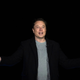 Elon Musk gestures as he speaks during a press conference at SpaceX's Starbase.